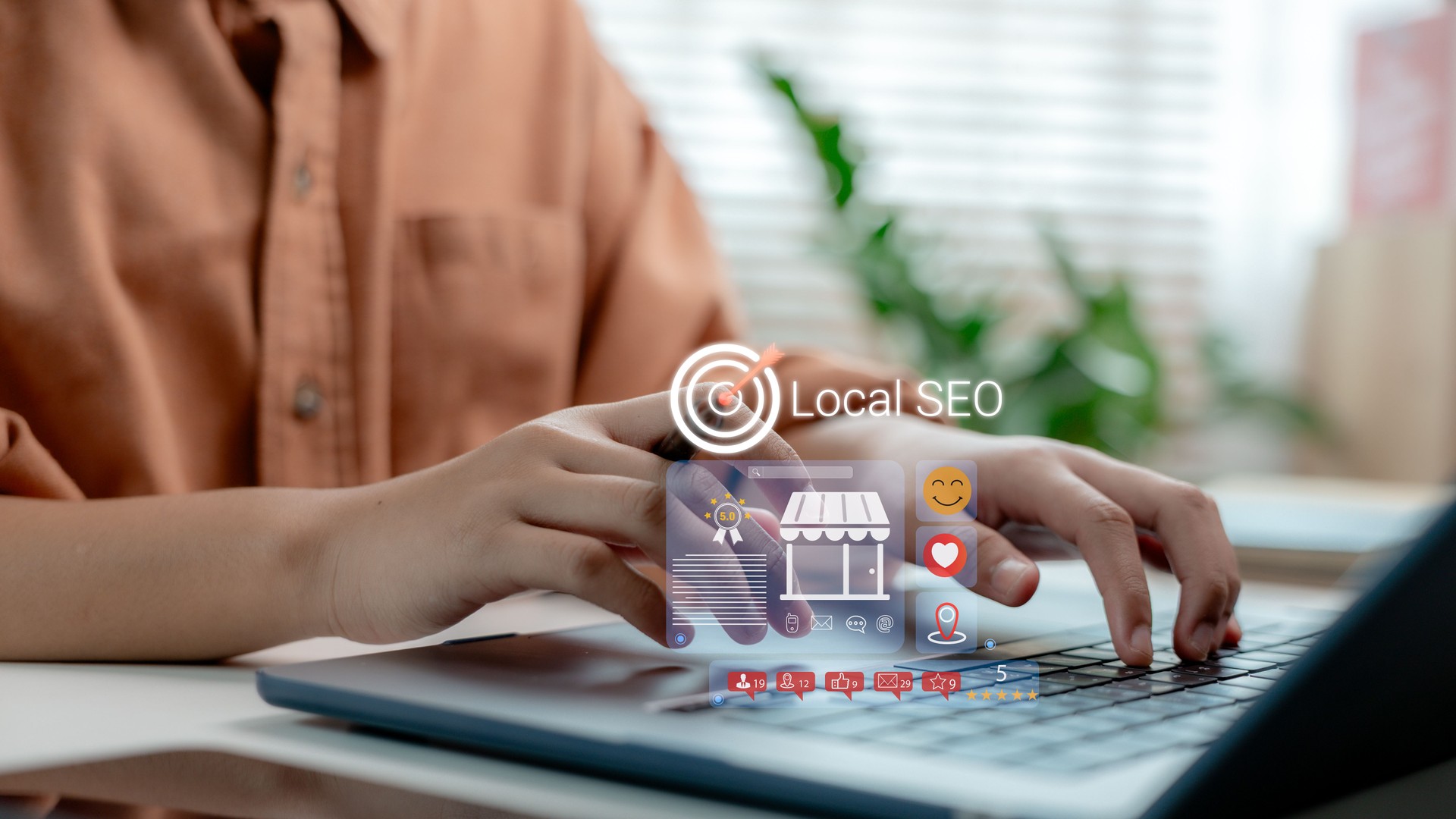 Hands typing on laptop with Local SEO interface, showing location pin, reviews, social likes, and ratings, representing local business visibility, digital engagement, and smart search optimization.